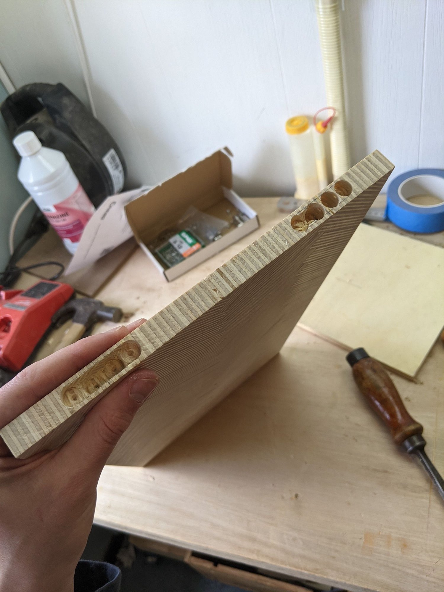 I squared off the piece and started to work on the hinges. I really challenged myself here using invisible soss 101 hinges. With the plywood being so thin on the sides, i had to be really careful using the drill chisel.