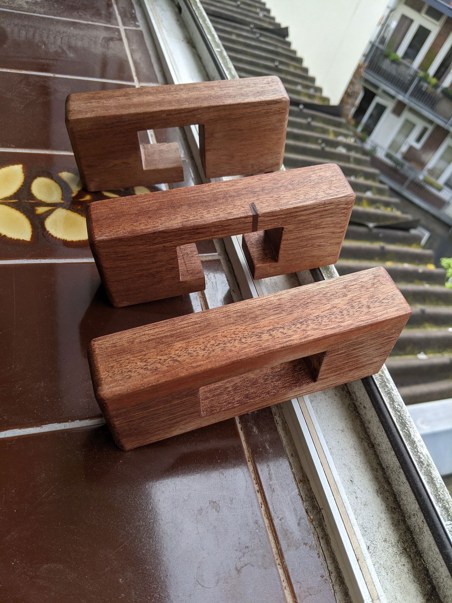 Rounded off the edges with my trim router and sanded them down. Finished them with some wax to make them glossy and slide easily.